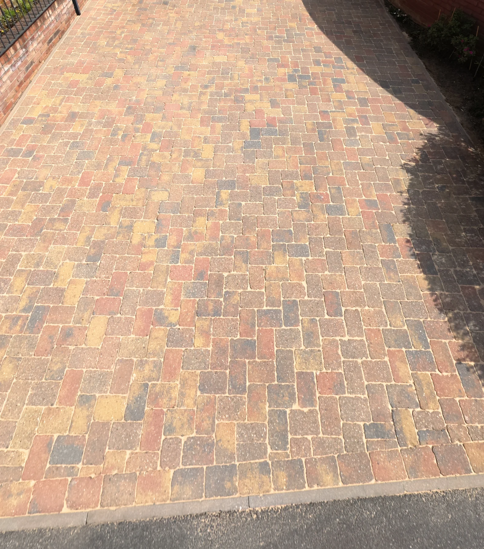 Clean block paving across a residential driveway